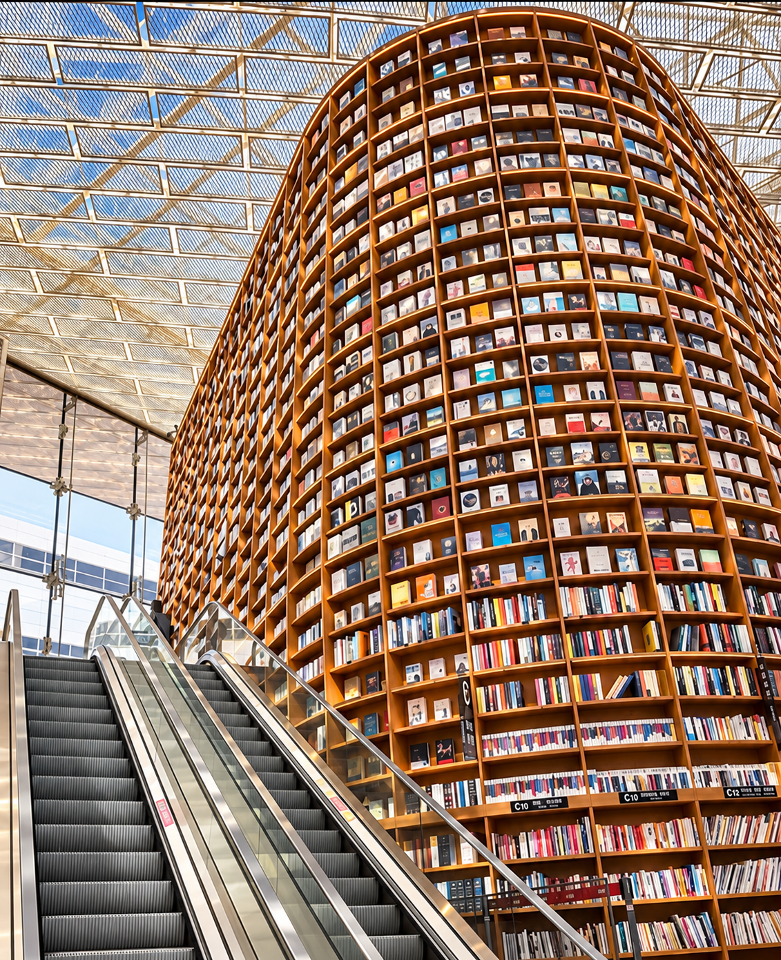 A monumental library atrium in Seoul with colourful bookshelves